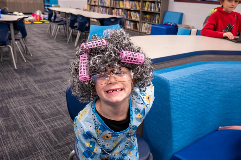girl with gray wig and curlers